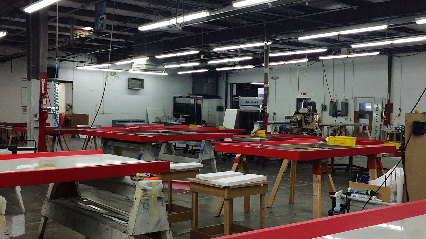 A modern makerspace lab with computers and workstations.